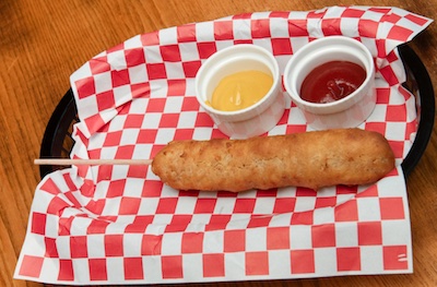 Corn Dog with ketchup and mustard